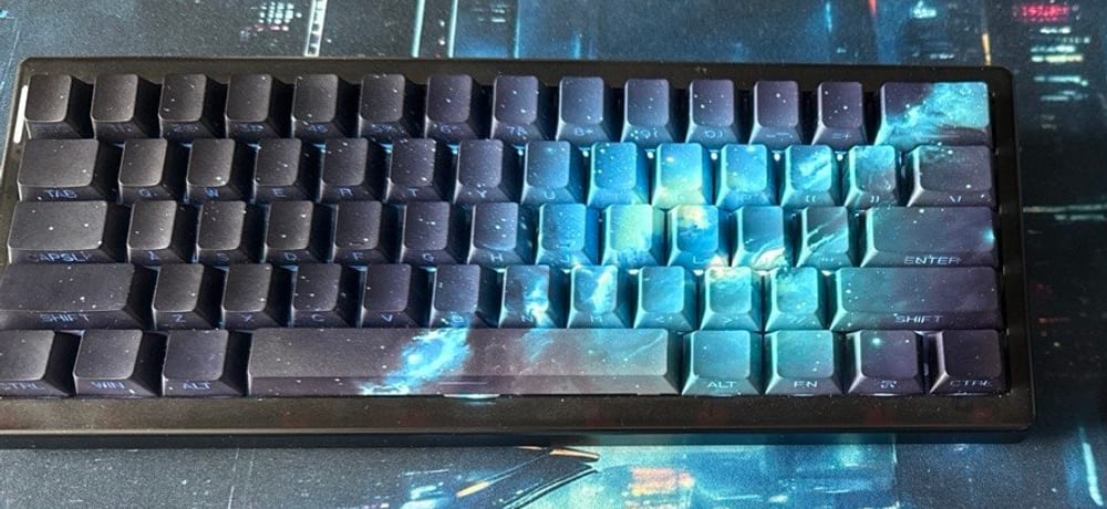 Cidoo QK61 sixty-percent keyboard with galaxy-print keycaps, seen from above