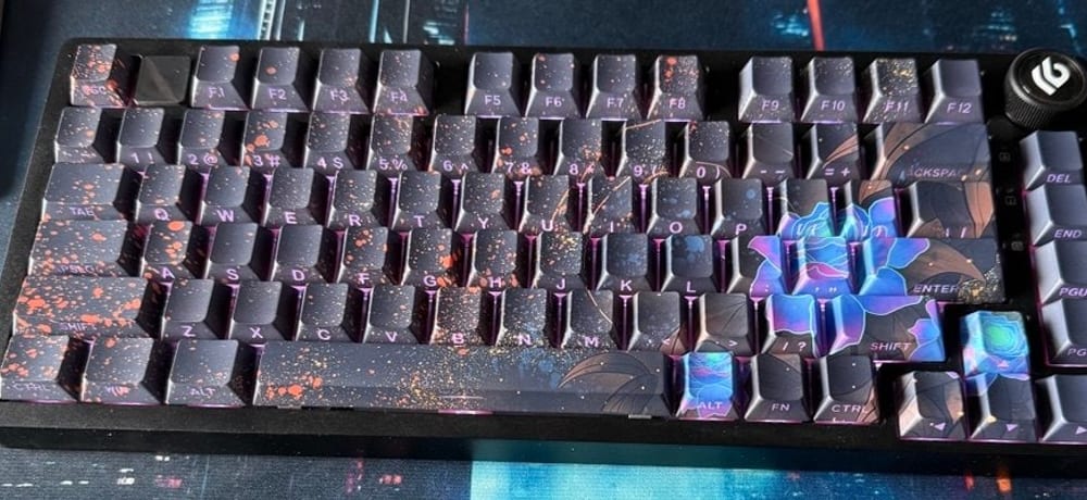 Leobog Hi75 keyboard with dark purple patterned keycaps and blue floral accent keys
